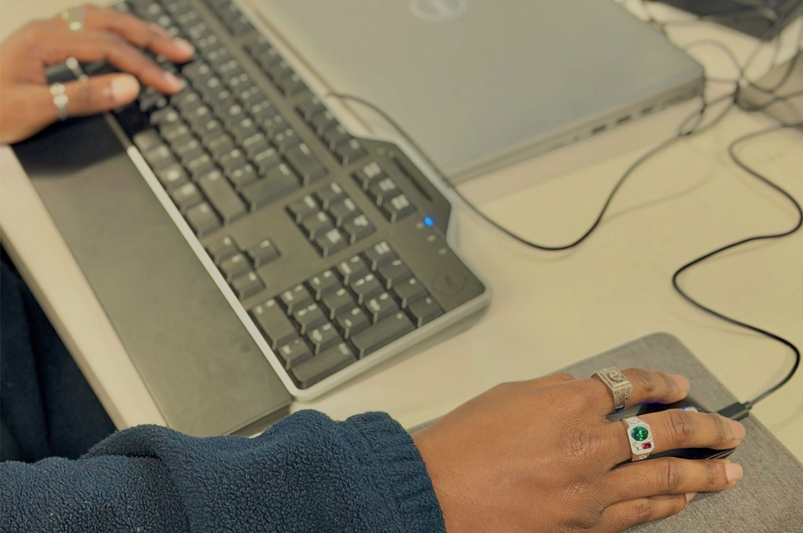 Colleague with hands on computer mouse