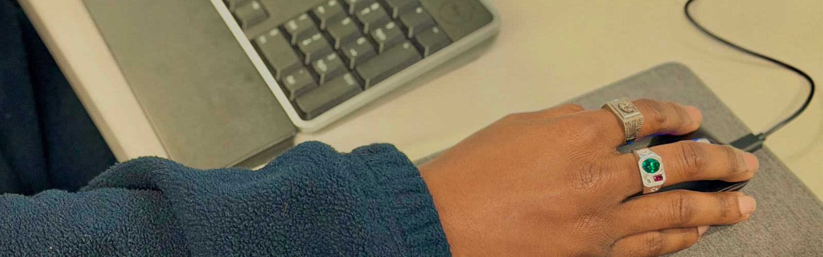 Colleague with hands on computer mouse