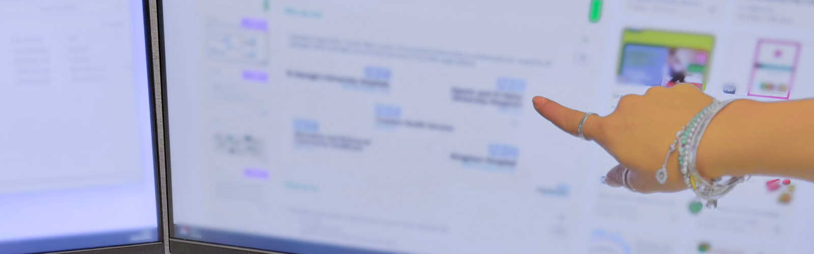 Colleague pointing at screen